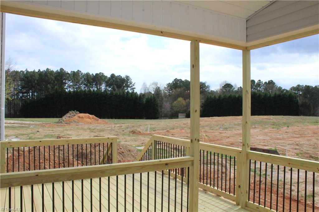 2629 Lunsford Road Summerfield, NC 27358 - Photo 21 of 28 Covered porch, enjoy the beautiful sunsets.