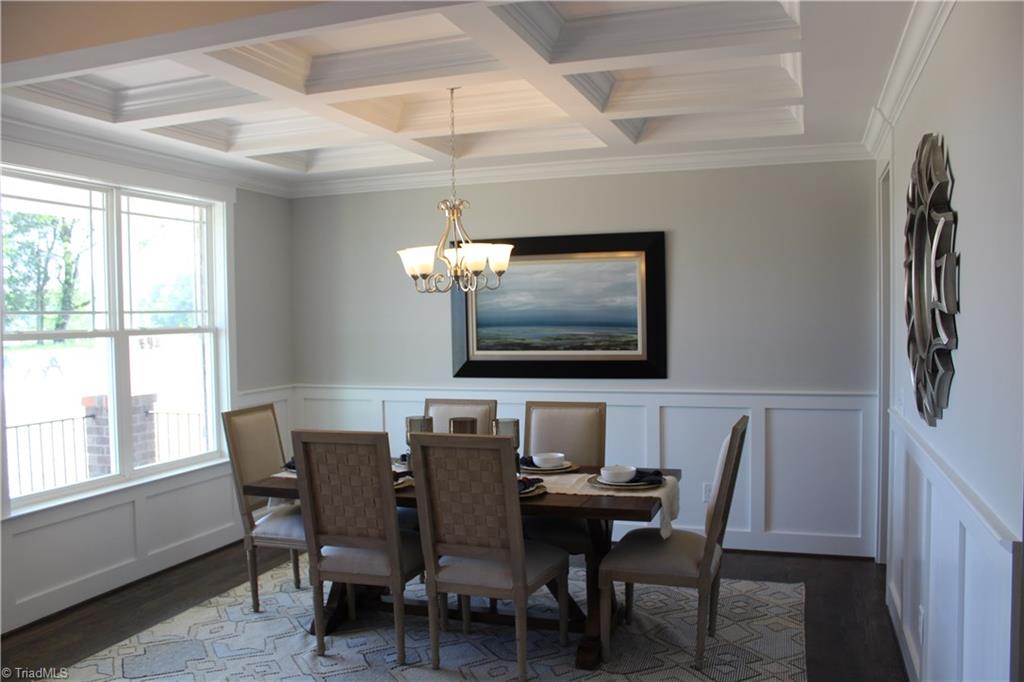 Dining Room featuring Coffered Ceiling and craftsman trim package