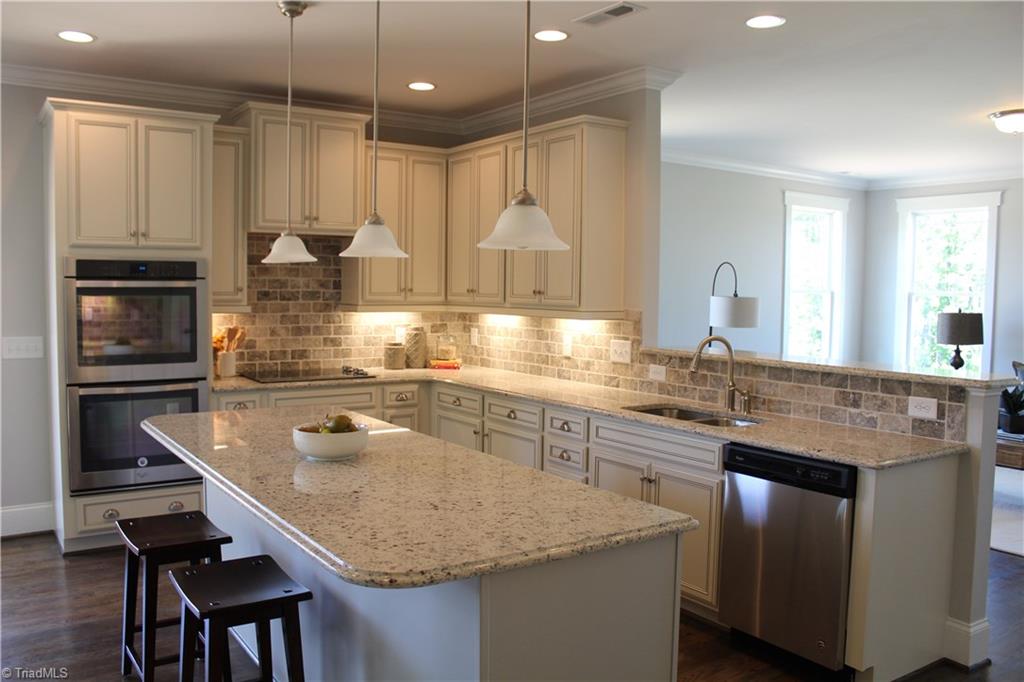 2629 Lunsford Road Summerfield, NC 27358 - Photo 8 of 28 Gourmet Kitchen with double Island and Butler's Pantry!