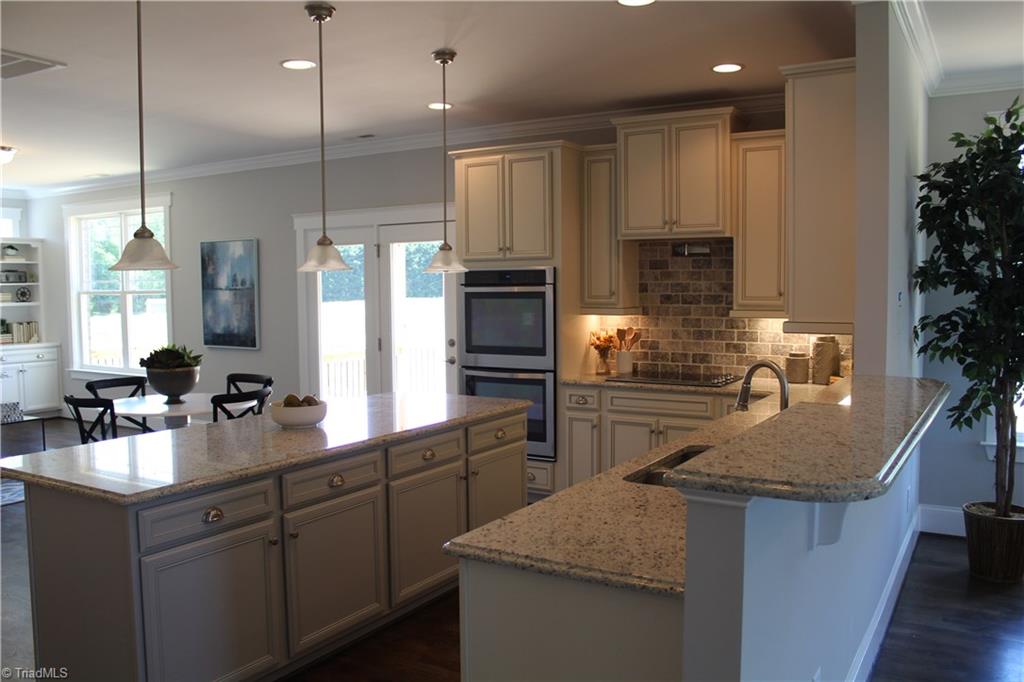 2629 Lunsford Road Summerfield, NC 27358 - Photo 9 of 28 Another view of Kitchen featuring the double Island - Kitchen cabinets by local Marsh Cabinets!