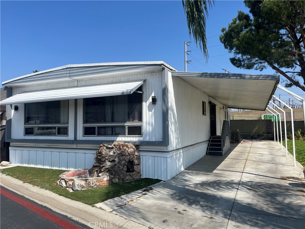 2930 West Rialto Avenue, Unit 21 Rialto, CA 92376 - Photo 3 of 5 a view of house with outdoor space