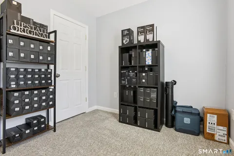 a view of a bedroom with cabinets