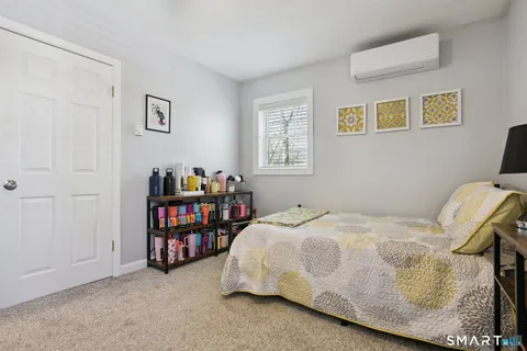 a bedroom with a bed and a closet