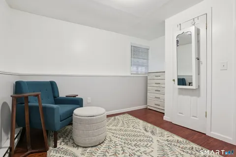 a bathroom with a toilet and a mirror