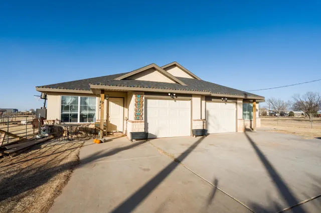a large house with a large window and yard