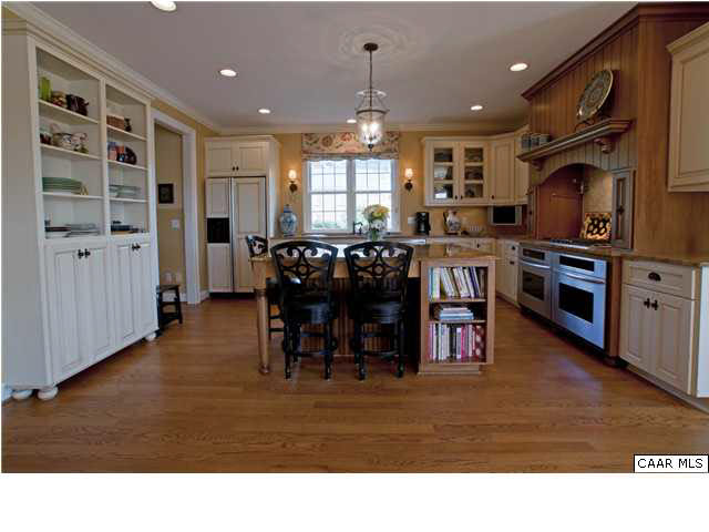 3505 Rocks Mill Lane Charlottesville, VA 22903 - Photo 14 of 33 a living room with stainless steel appliances kitchen island granite countertop a table chairs and a refrigerator