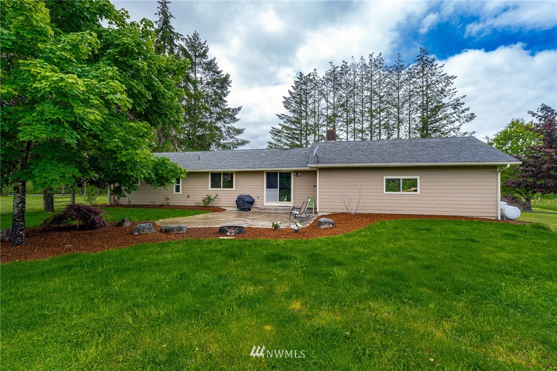 147 Lake Creek Road Chehalis, WA 98532 - Photo 22 of 30 a front view of house with yard and outdoor seating