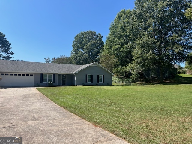 155 Hilo Road Fayetteville, GA 30215 - Photo 11 of 15 a front view of a house with a garden