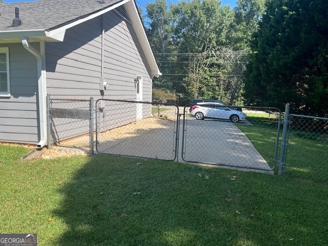 155 Hilo Road Fayetteville, GA 30215 - Photo 12 of 15 a view of a backyard with small cabin