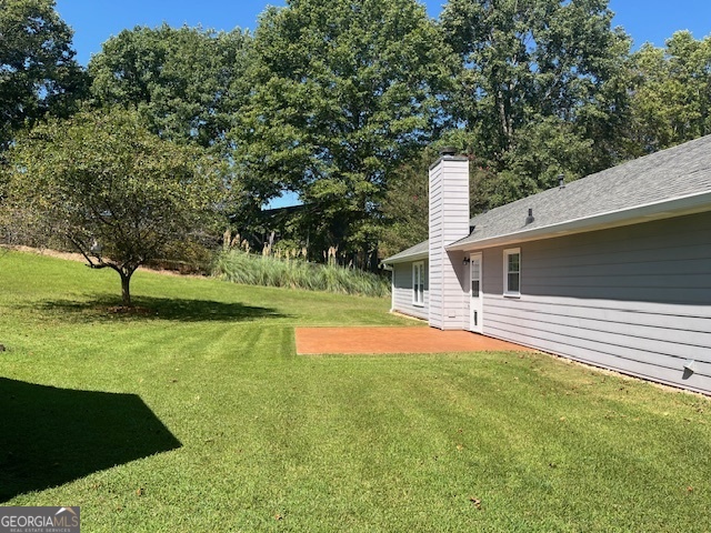 155 Hilo Road Fayetteville, GA 30215 - Photo 13 of 15 a view of a house with a yard