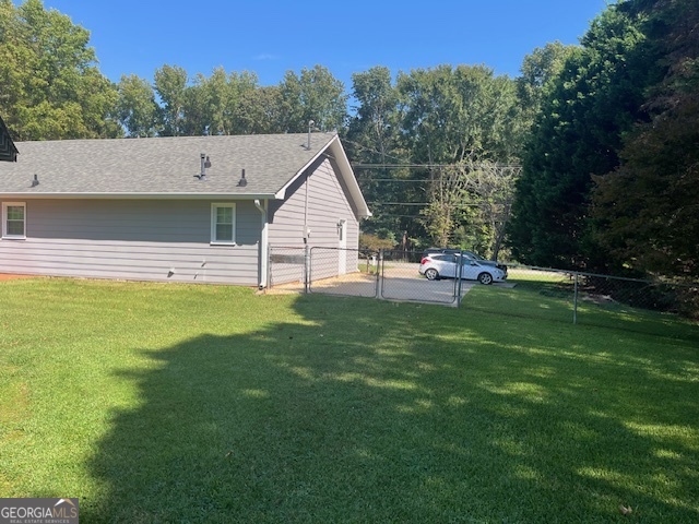 155 Hilo Road Fayetteville, GA 30215 - Photo 15 of 15 a view of a house with a yard and sitting area