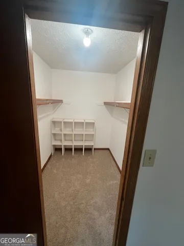 a view of room with stairs and a window