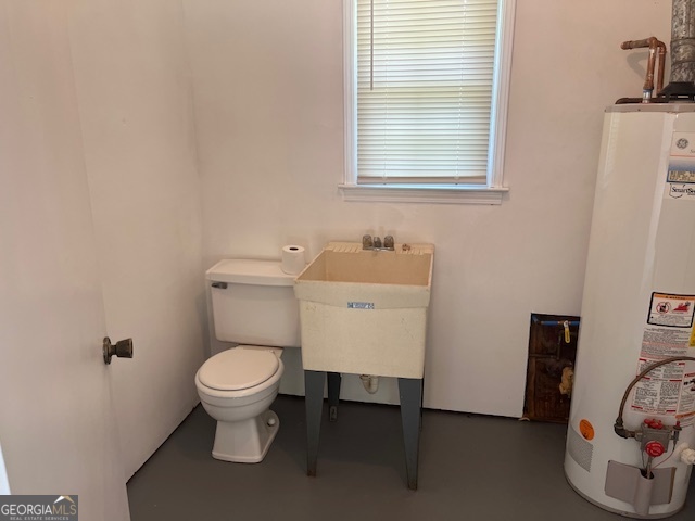 155 Hilo Road Fayetteville, GA 30215 - Photo 4 of 15 a bathroom with a toilet and a sink