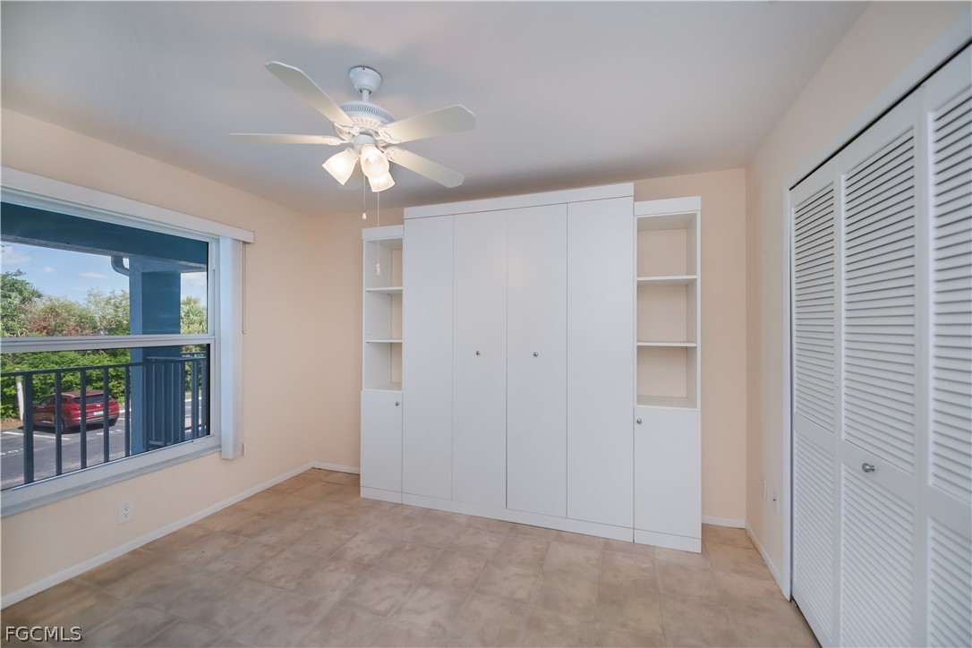 1100 Pondella Road, Unit 514 Cape Coral, FL 33909 - Photo 13 of 34 an empty room with fan and windows