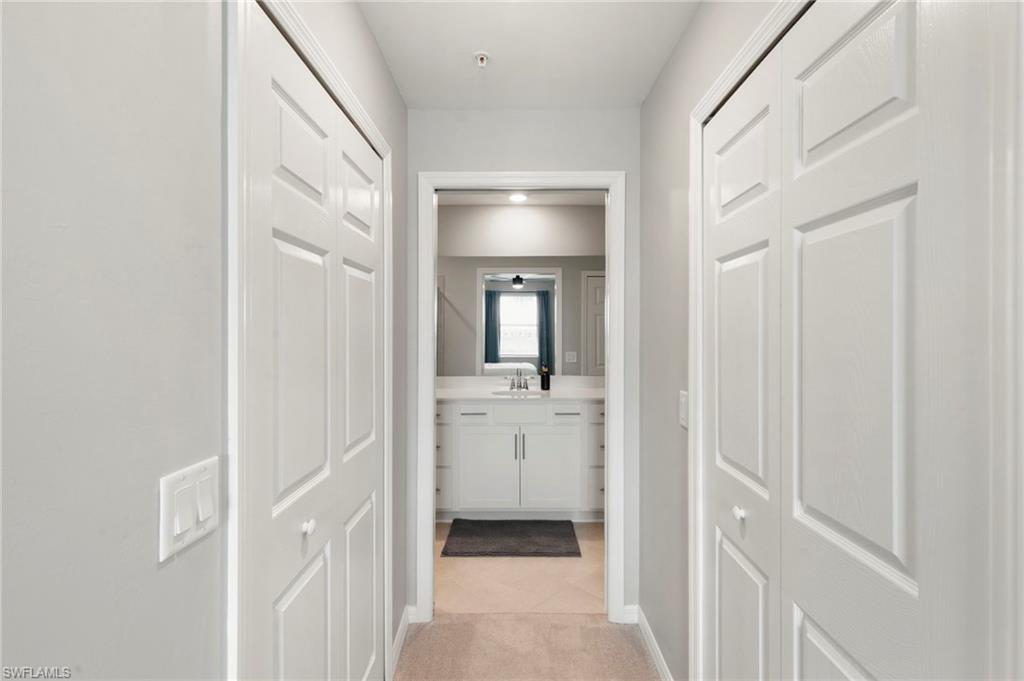 43993 Boardwalk Loop, Unit 1914 Punta Gorda, FL 33982 - Photo 15 of 36 Hallway featuring baseboards and light tile patterned floors