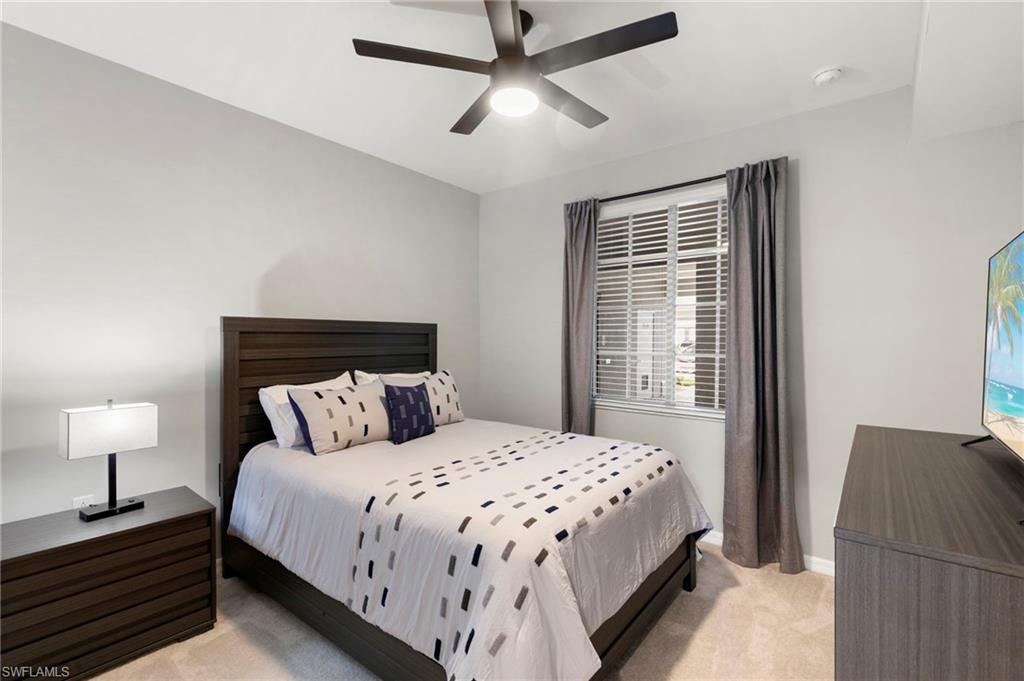 43993 Boardwalk Loop, Unit 1914 Punta Gorda, FL 33982 - Photo 17 of 36 Bedroom featuring light colored carpet and a ceiling fan