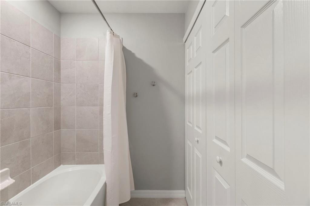 43993 Boardwalk Loop, Unit 1914 Punta Gorda, FL 33982 - Photo 20 of 36 Full bath featuring shower / bathtub combination with curtain and a closet
