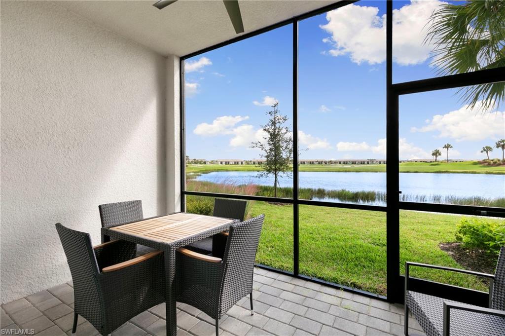 43993 Boardwalk Loop, Unit 1914 Punta Gorda, FL 33982 - Photo 22 of 36 Sunroom / solarium featuring a water view and ceiling fan