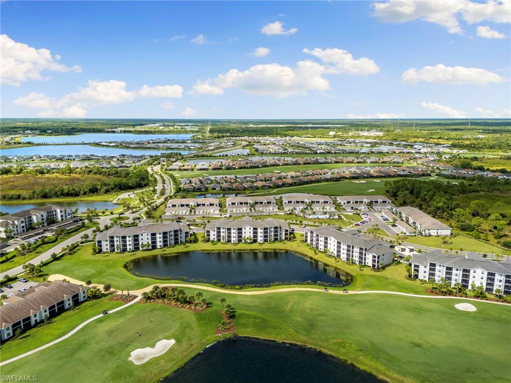 43993 Boardwalk Loop, Unit 1914 Punta Gorda, FL 33982 - Photo 26 of 36 Aerial perspective of suburban area with a golf club and a nearby body of water