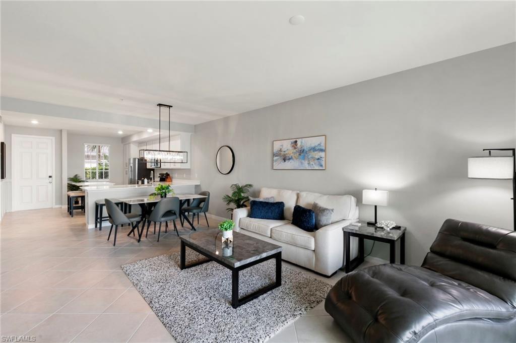 43993 Boardwalk Loop, Unit 1914 Punta Gorda, FL 33982 - Photo 10 of 36 Living area with light tile patterned floors and recessed lighting