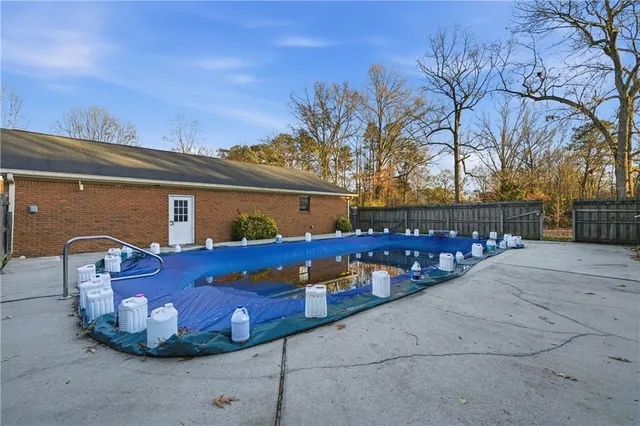 a view of a chairs and tables in the back yard of the house