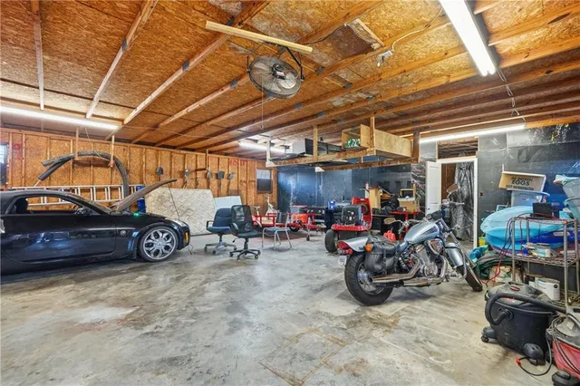 a view of parking garage with cars