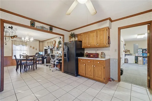 a view of kitchen with furniture and refrigerator