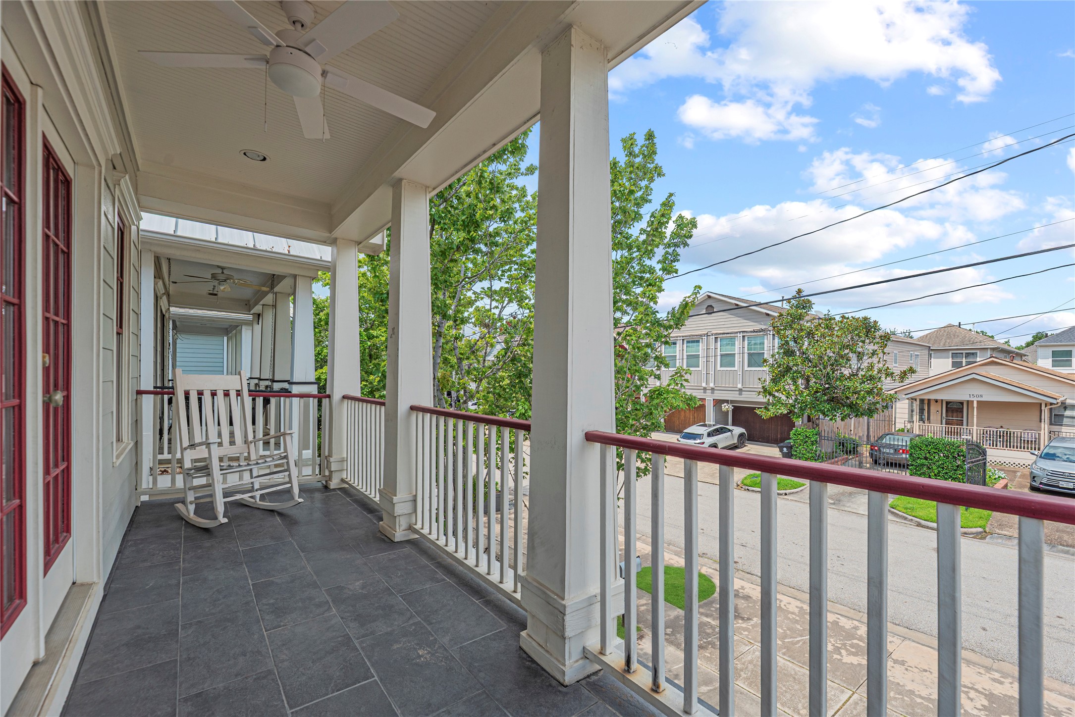 1505 Prince Street Houston, TX 77008 - Photo 19 of 39 Balcony off the primary bedroom features a ceiling fan and slate tile — perfect for morning coffee or evening relaxation.