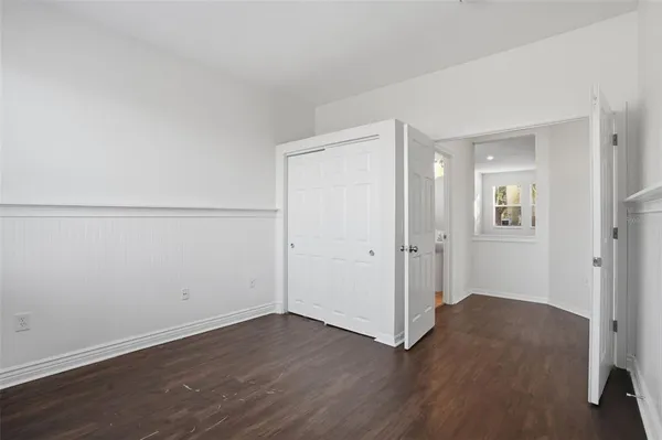 an empty room with wooden floor