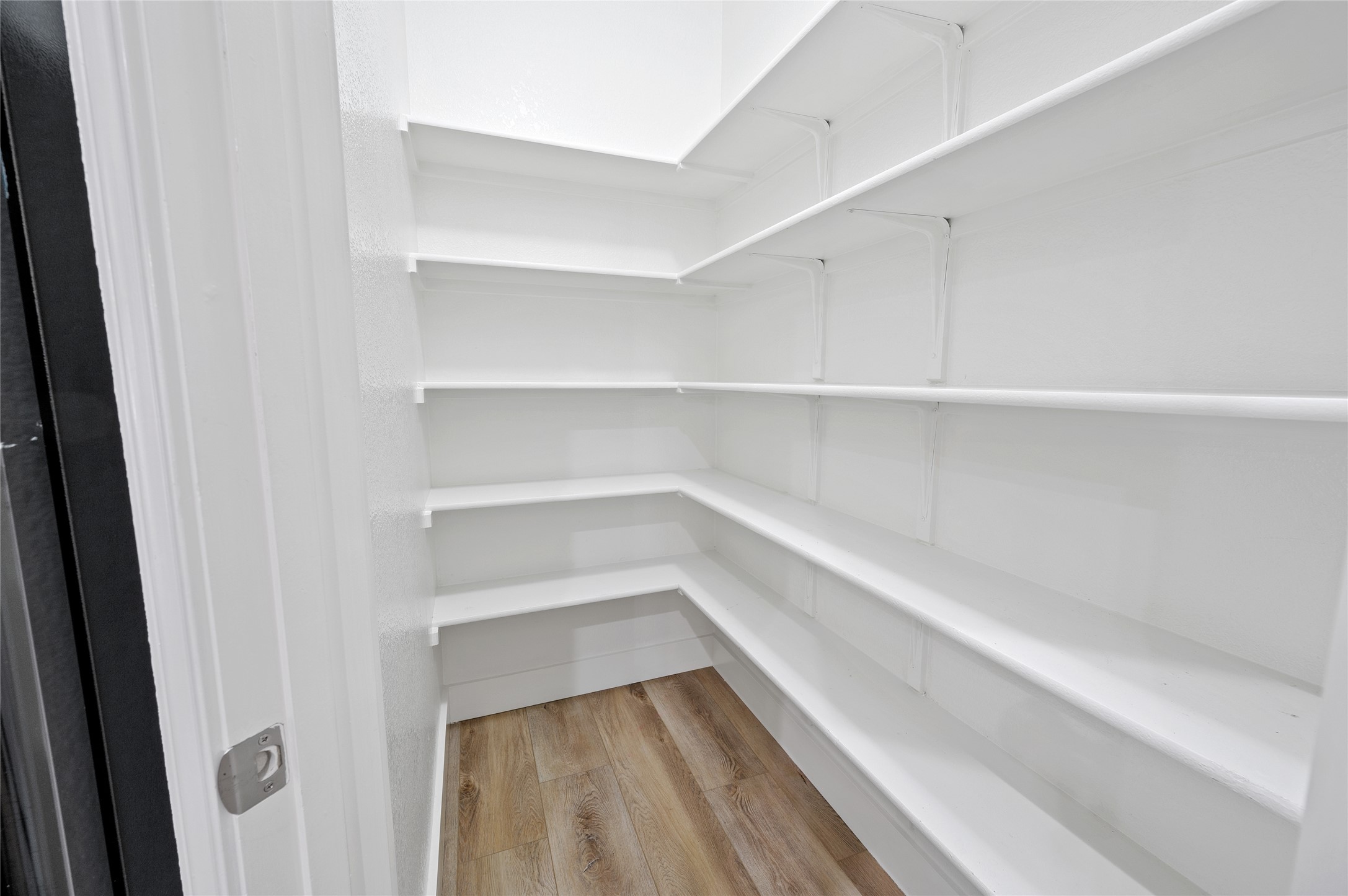4512 Pyrenees Pass Bee Cave, TX 78738 - Photo 13 of 35 a view of walk in closet with empty racks