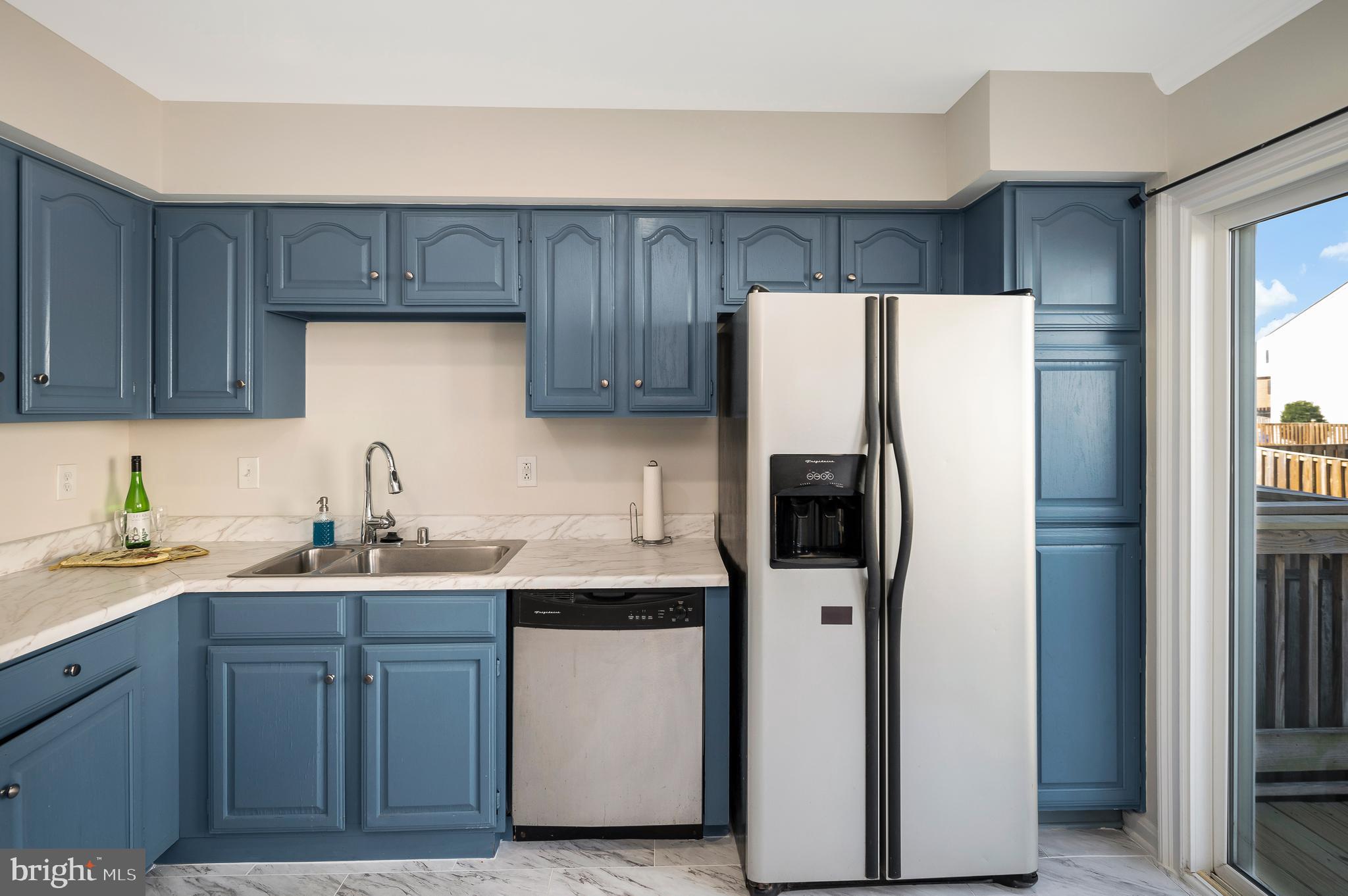 17950 Milroy Drive Dumfries, VA 22026 - Photo 13 of 42 a kitchen with stainless steel appliances a refrigerator and sink