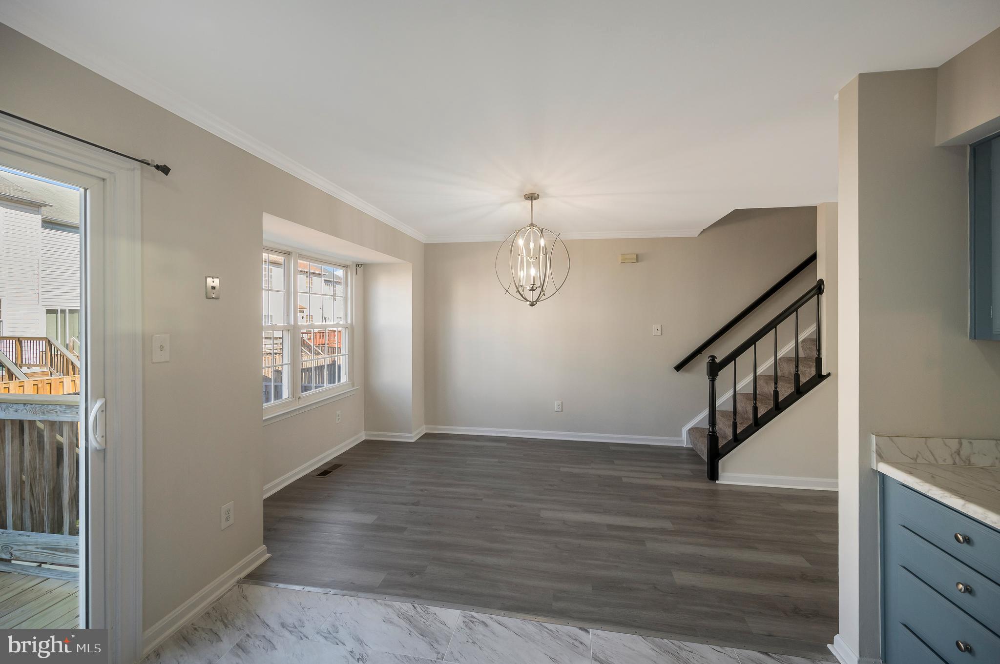 17950 Milroy Drive Dumfries, VA 22026 - Photo 17 of 42 a view of an entryway with wooden floor and staircase