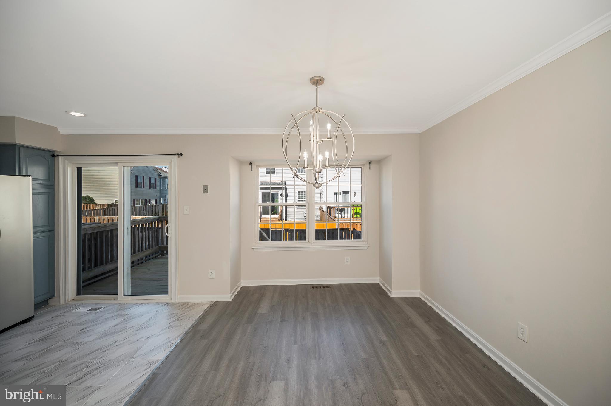 17950 Milroy Drive Dumfries, VA 22026 - Photo 19 of 42 wooden floor in an empty room with a window