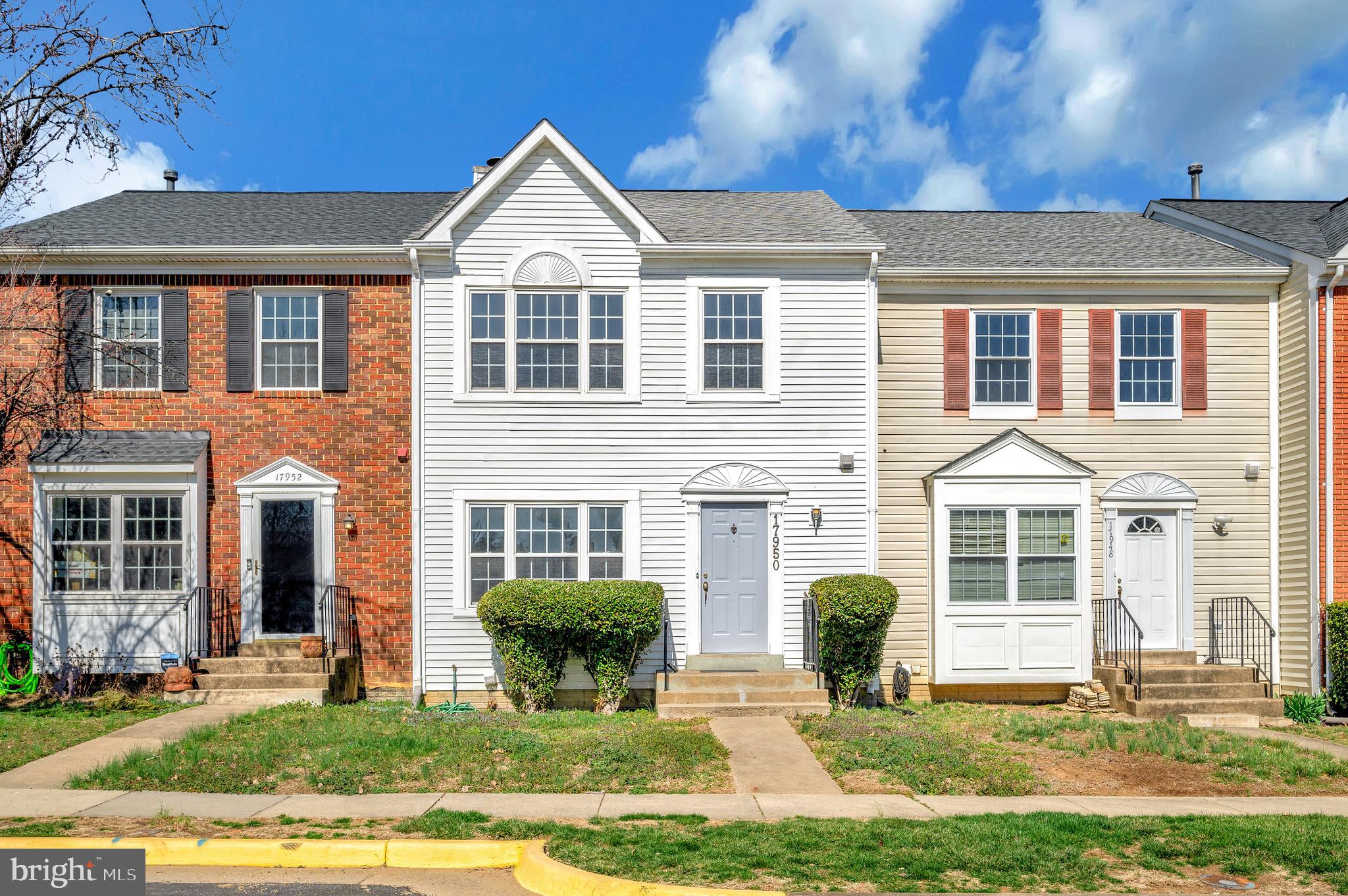 17950 Milroy Drive Dumfries, VA 22026 - Photo 2 of 42 a front view of a house with a yard