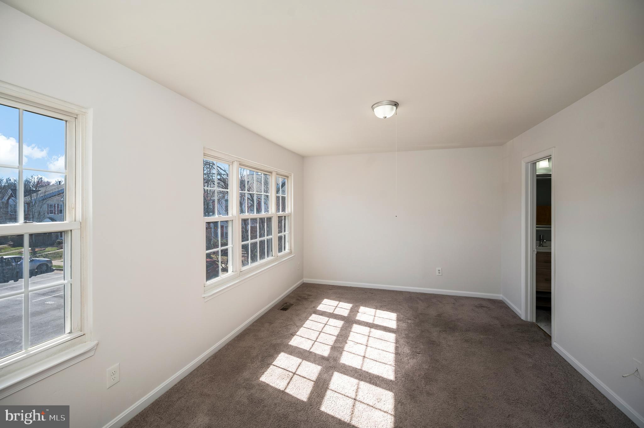 17950 Milroy Drive Dumfries, VA 22026 - Photo 21 of 42 a view of empty room with windows