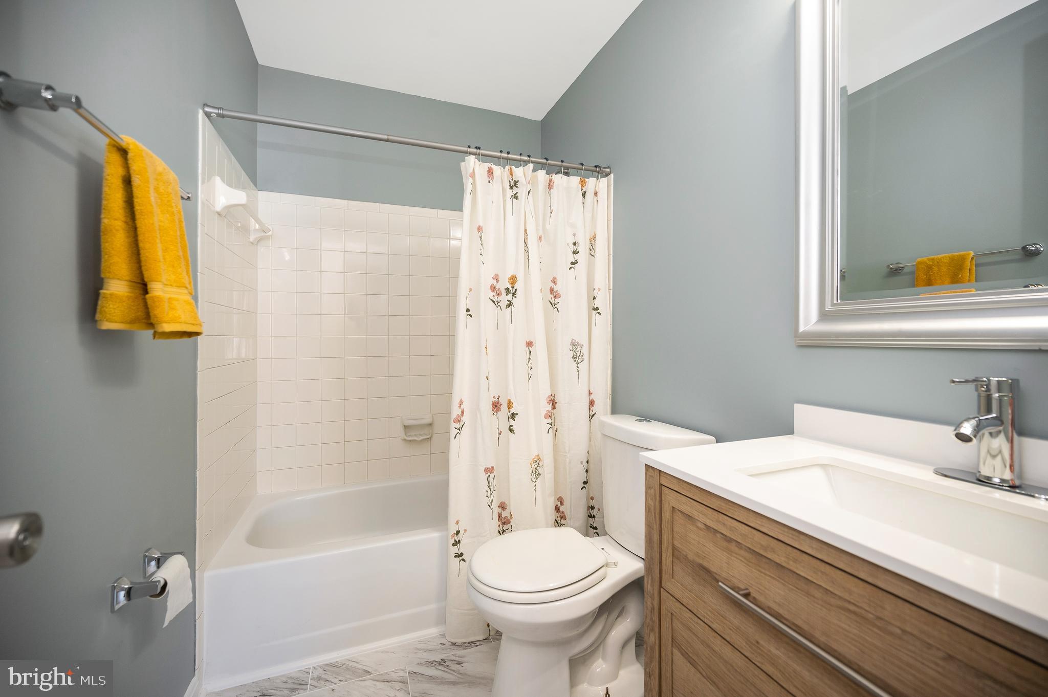 17950 Milroy Drive Dumfries, VA 22026 - Photo 28 of 42 a bathroom with a sink a toilet and shower