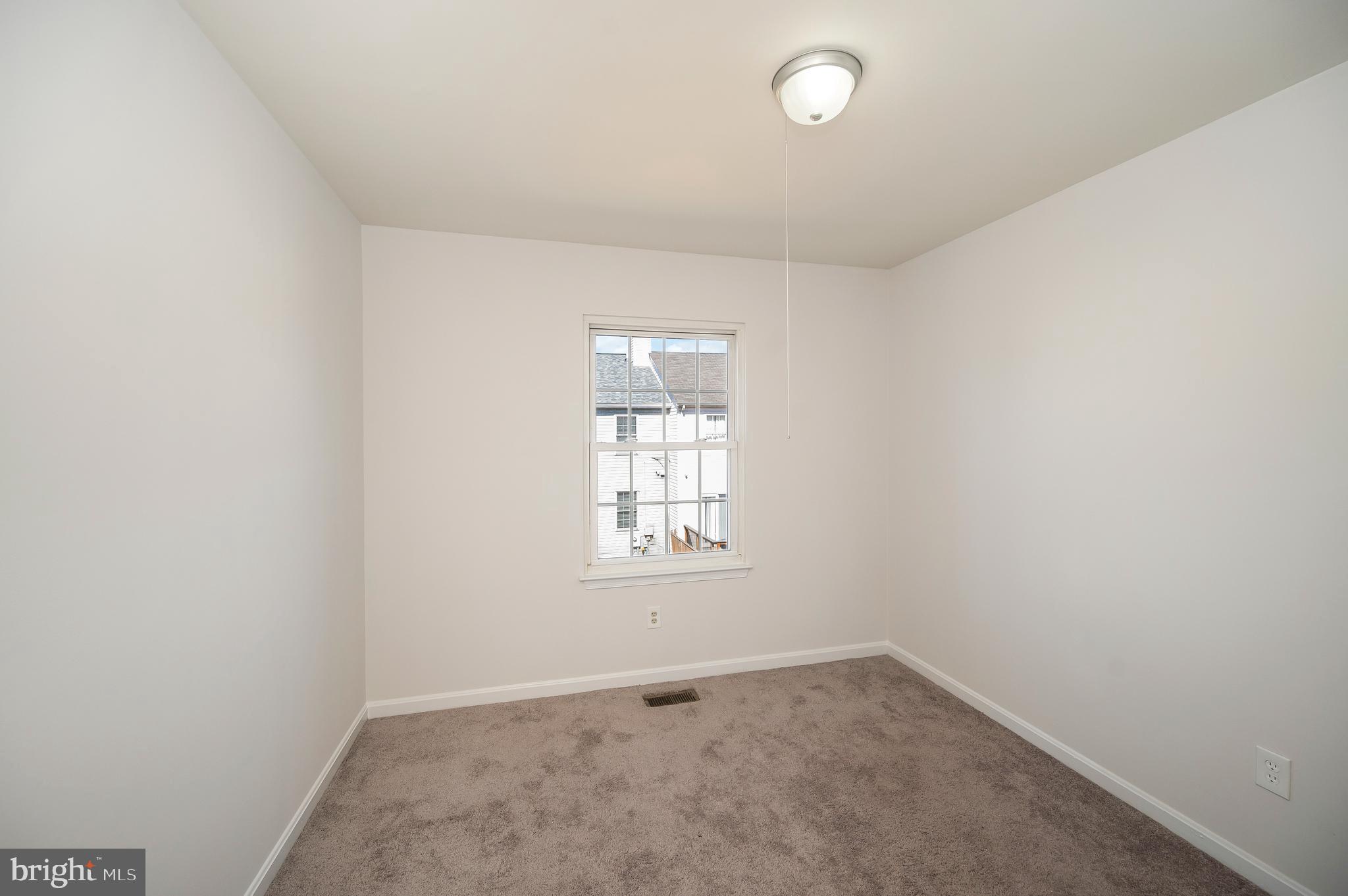 17950 Milroy Drive Dumfries, VA 22026 - Photo 29 of 42 an empty room with a window