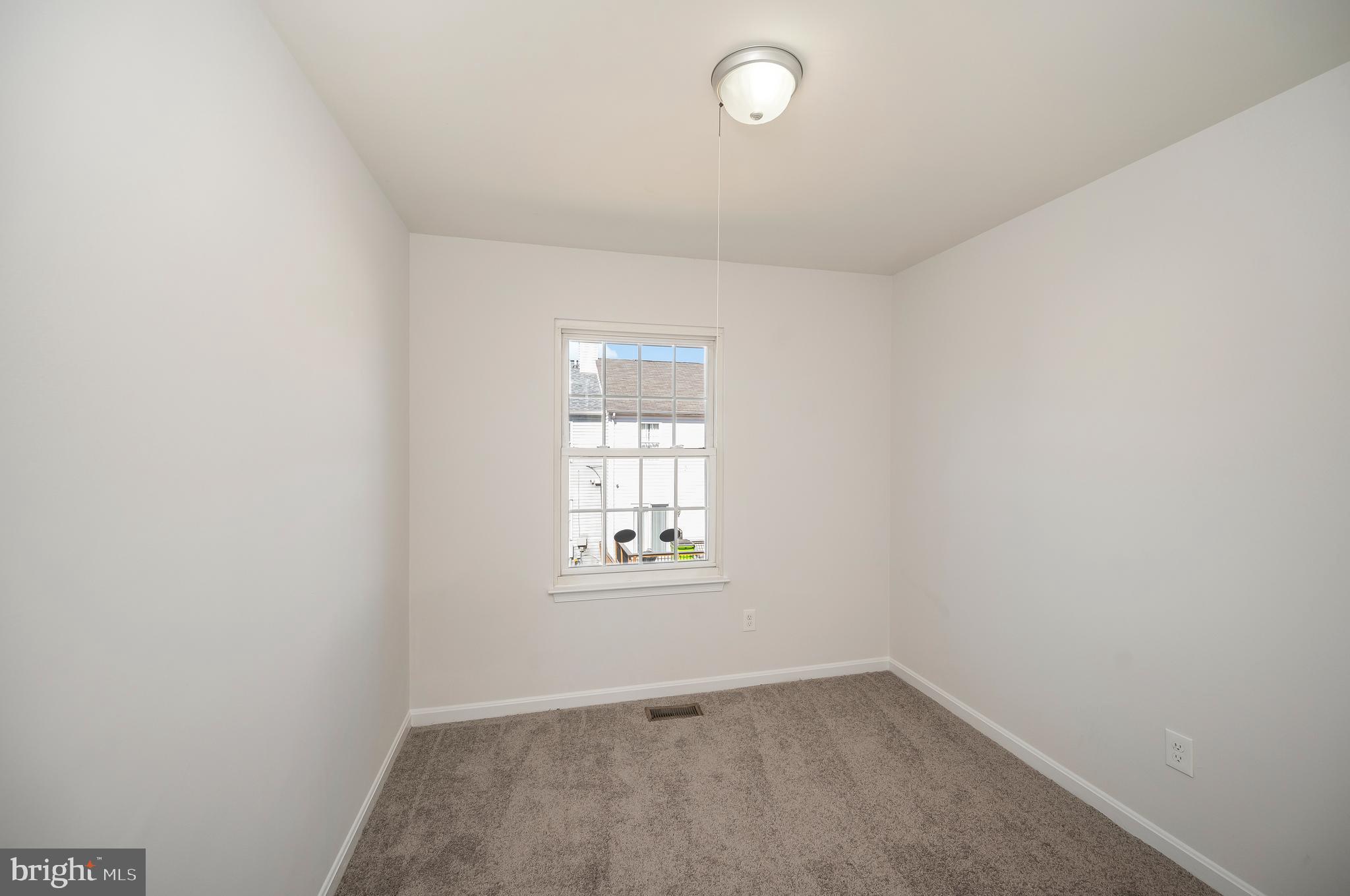 17950 Milroy Drive Dumfries, VA 22026 - Photo 31 of 42 an empty room with a window