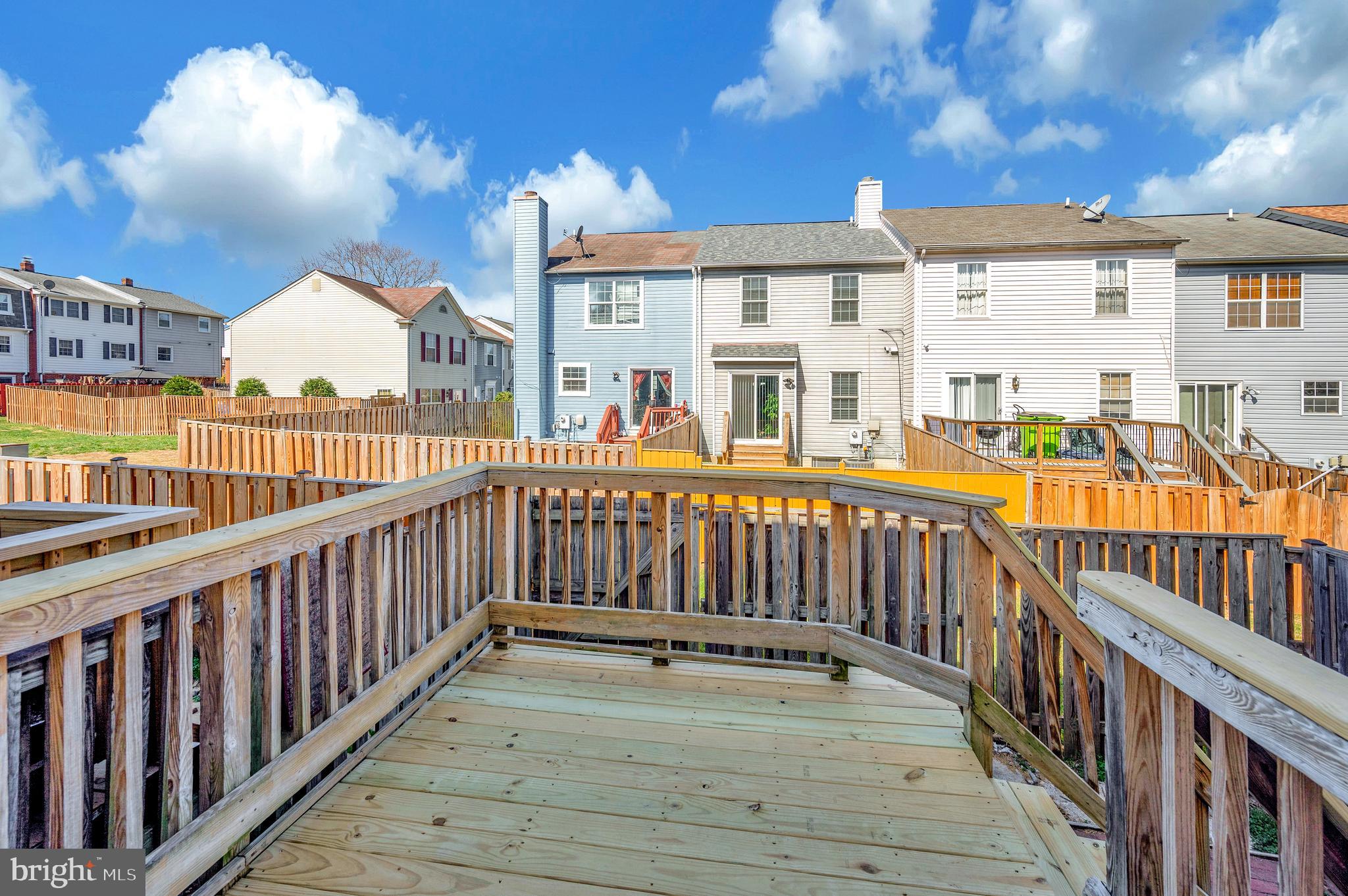 17950 Milroy Drive Dumfries, VA 22026 - Photo 39 of 42 a view of a house with wooden deck