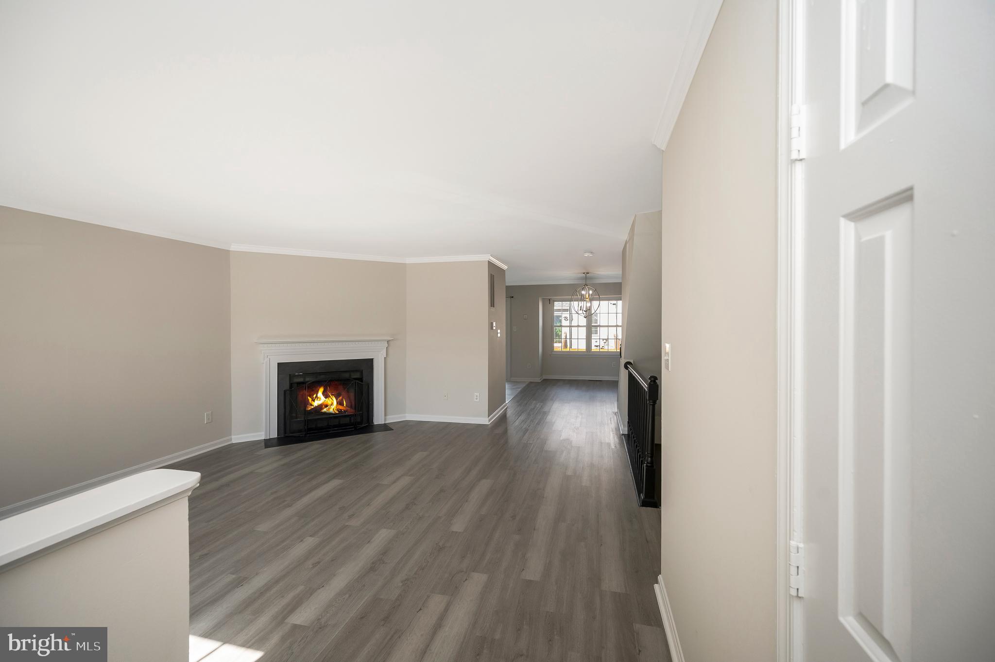17950 Milroy Drive Dumfries, VA 22026 - Photo 5 of 42 a view of an empty room with wooden floor and a window