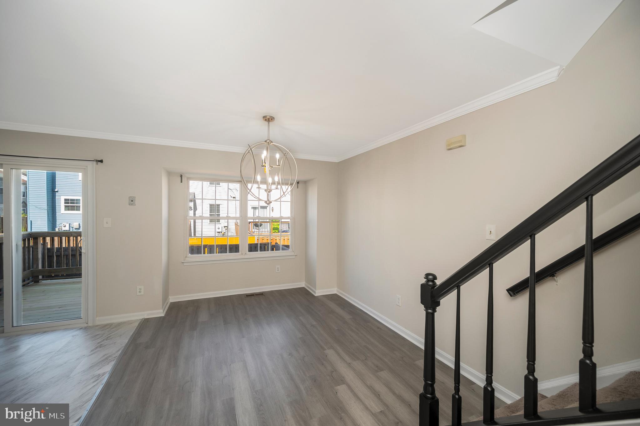 17950 Milroy Drive Dumfries, VA 22026 - Photo 10 of 42 a view of an entryway with wooden floor and garden