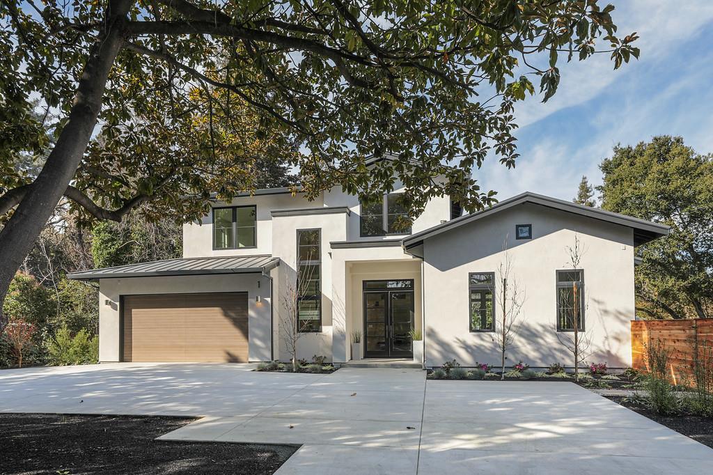 a front view of a house with a garage