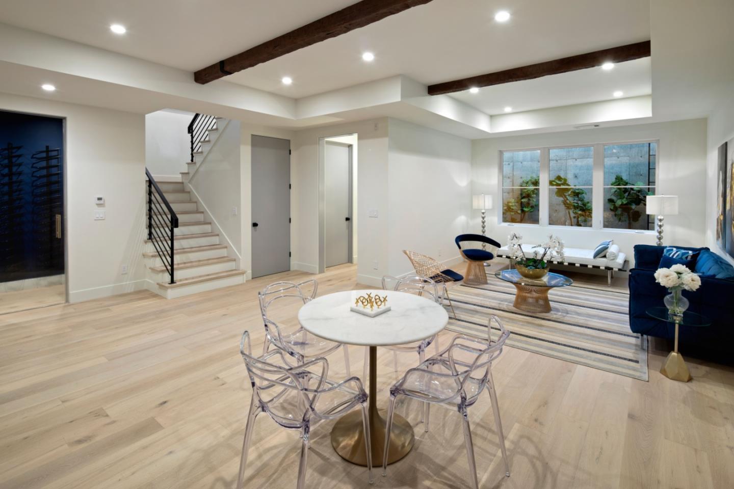 1 Holbrook Lane Atherton, CA 94027 - Photo 12 of 19 a living room with furniture a wooden floor and a chandelier