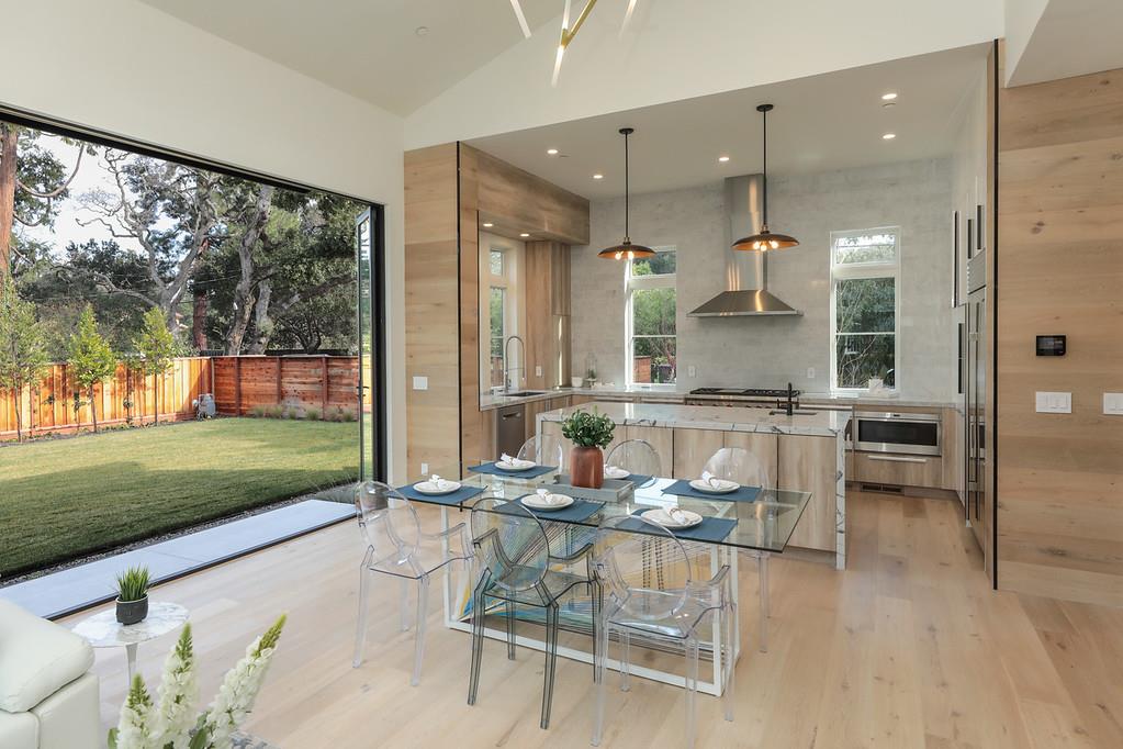 1 Holbrook Lane Atherton, CA 94027 - Photo 3 of 19 a living room with a floor to ceiling window and wooden floor