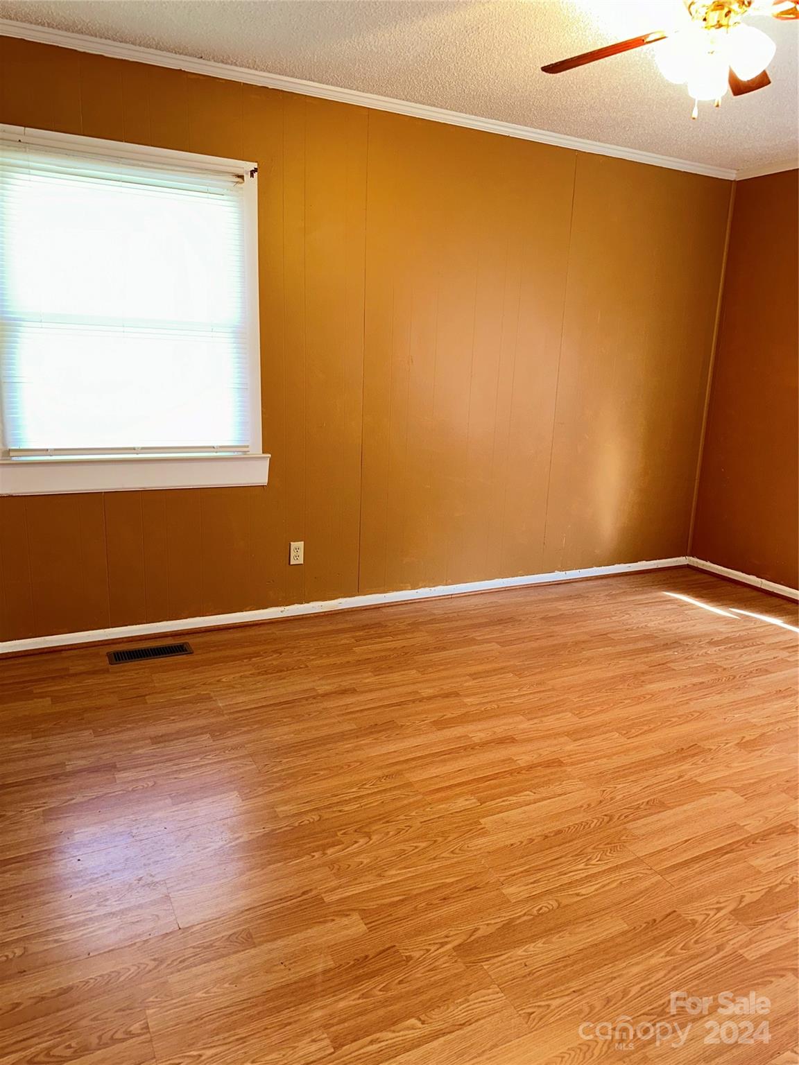 116 Haygood Road Blythewood, SC 29016 - Photo 17 of 34 a view of an empty room with wooden floor and a window