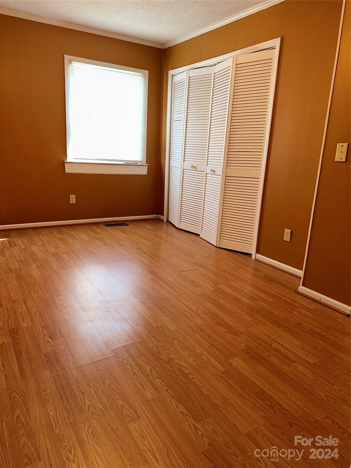 116 Haygood Road Blythewood, SC 29016 - Photo 21 of 34 an empty room with wooden floor and windows