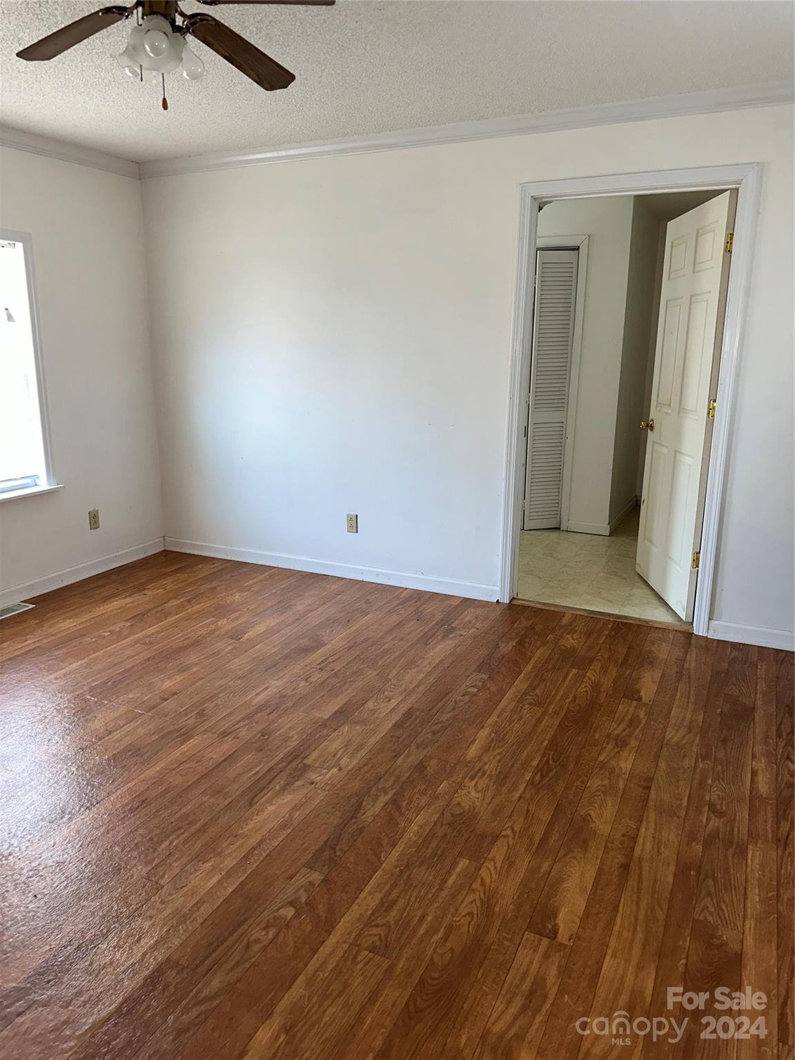 116 Haygood Road Blythewood, SC 29016 - Photo 27 of 34 an empty room with wooden floor and fan