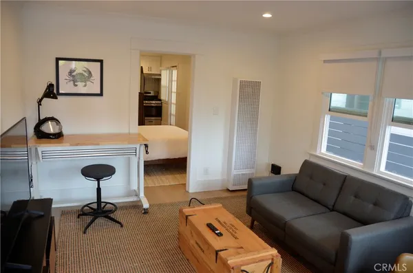 a view of workspace with furniture and windows