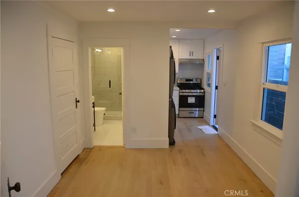 a view of a hallway with an outdoor space