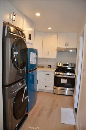 a kitchen with a stove and a refrigerator